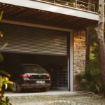 garage door with car parked front it